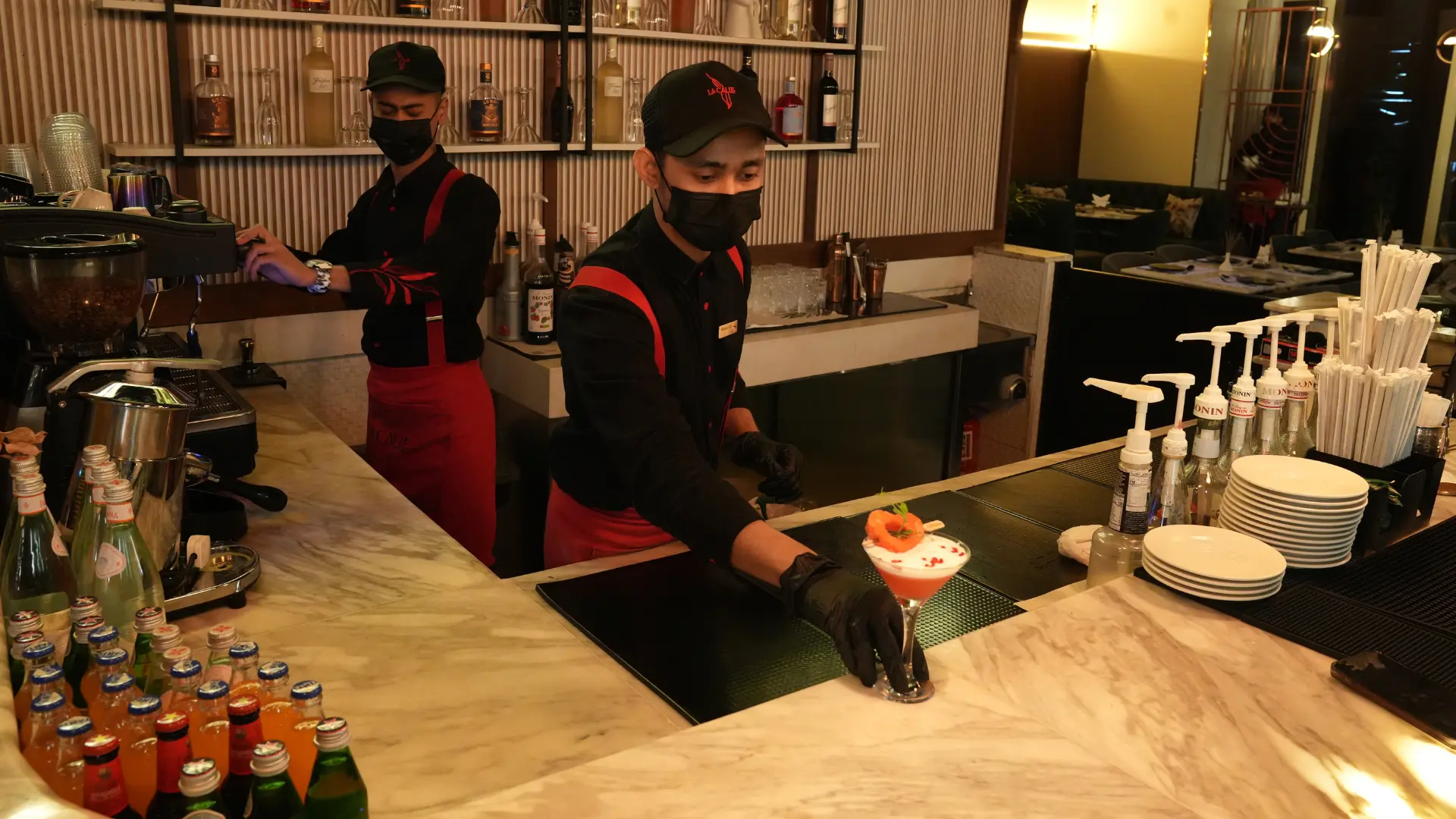 lacalle's two staff serving drinks